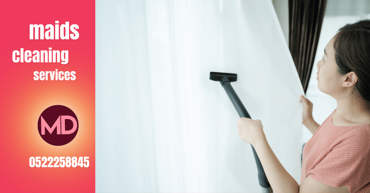 TheMaids.ae professional team performing curtain cleaning at home